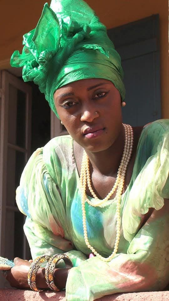 Woman in green traditional headwrap, Senegal
