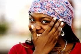 Woman laughing, traditional headwrap